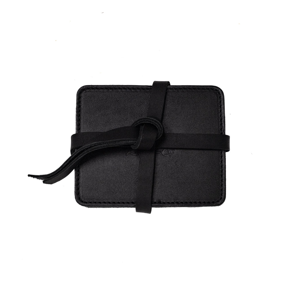 Leather Coaster Set in Black, stacked coasters wrapped and knotted with a leather tie
