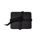 Leather Coaster Set in Black, stacked coasters wrapped and knotted with a leather tie