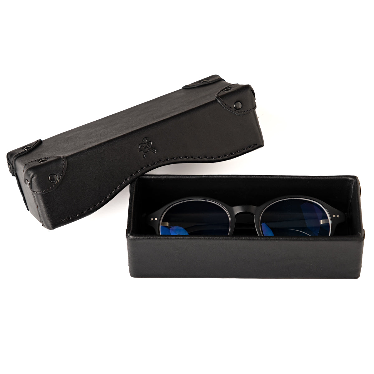 Grandfather Eyeglass Case in Black leather, open with a pair of round eyeglasses inside and lid beside it