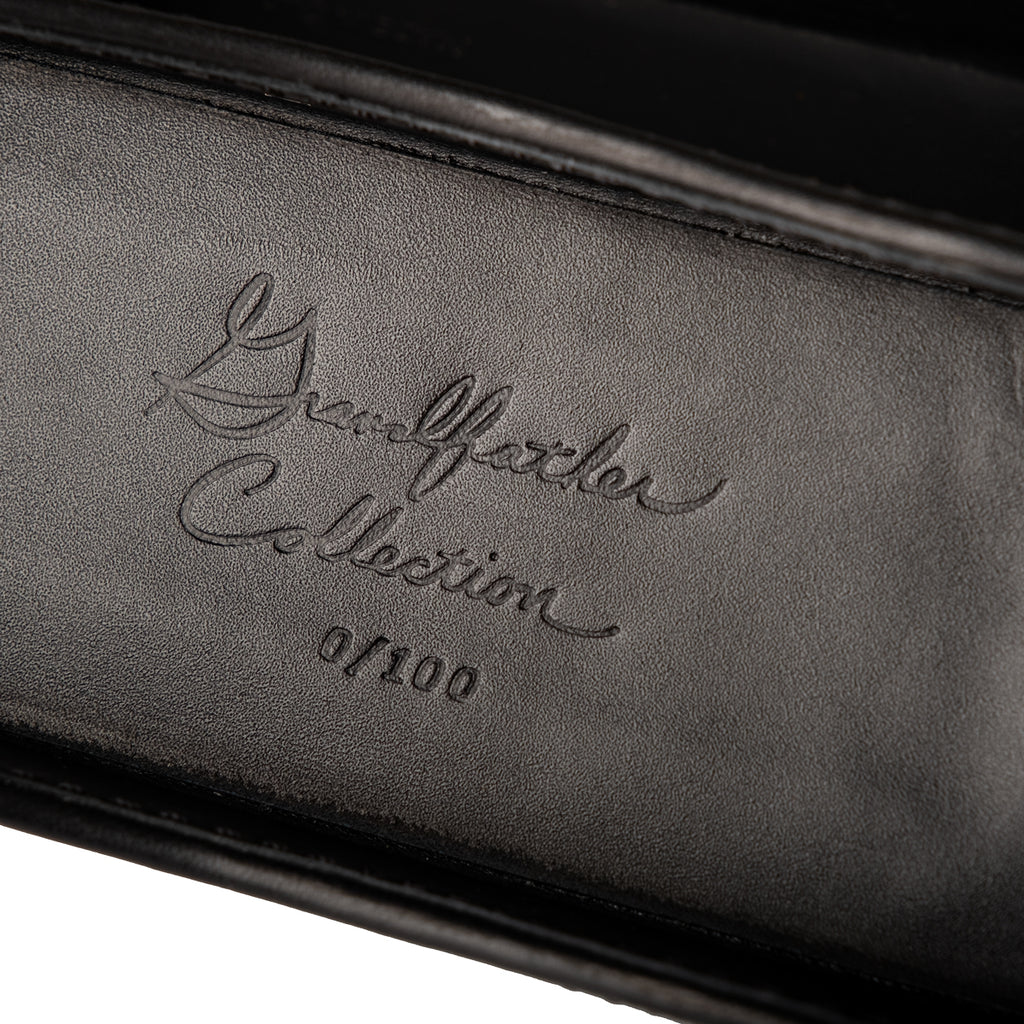 Grandfather Eyeglass Case in Black leather, close-up of embossed Grandfather Collection script and edition number