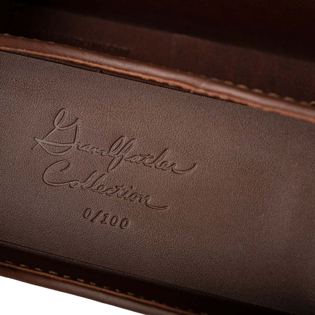 Grandfather Eyeglass Case in Chestnut leather, close-up of embossed Grandfather Collection script and edition number