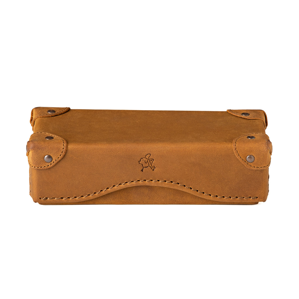 Grandfather Eyeglass Case in Tobacco leather, closed front view with riveted corner caps and embossed tortoise