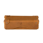 Grandfather Eyeglass Case in Tobacco leather, closed front view with riveted corner caps and embossed tortoise