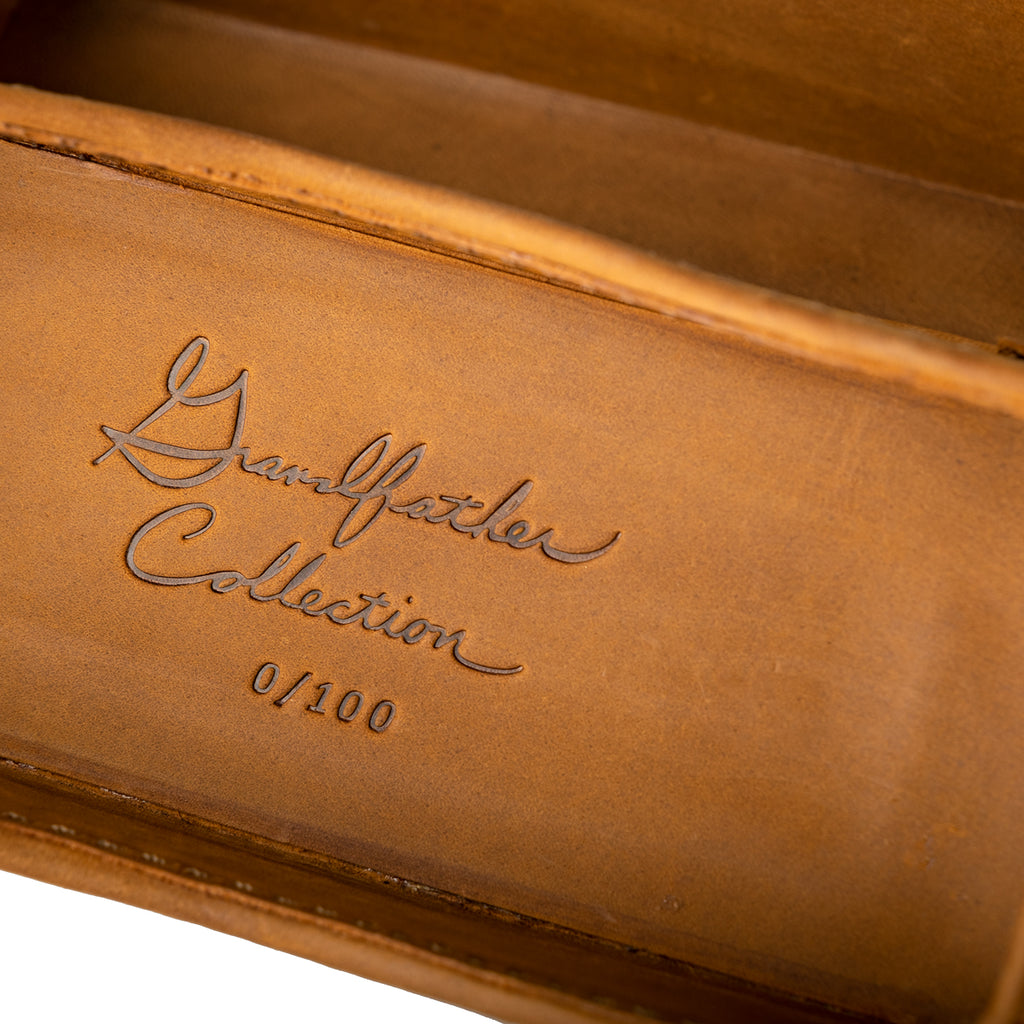 Grandfather Eyeglass Case in Tobacco leather, close-up of embossed Grandfather Collection script and edition number