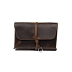Large Leather Organizer Bag in Dark Coffee Brown, closed flap with wrapped leather tie and ring, front view