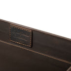 Grandfather Serving Tray in Dark Coffee Brown, close-up of stitched Grandfather Collection patch on the inner wall
