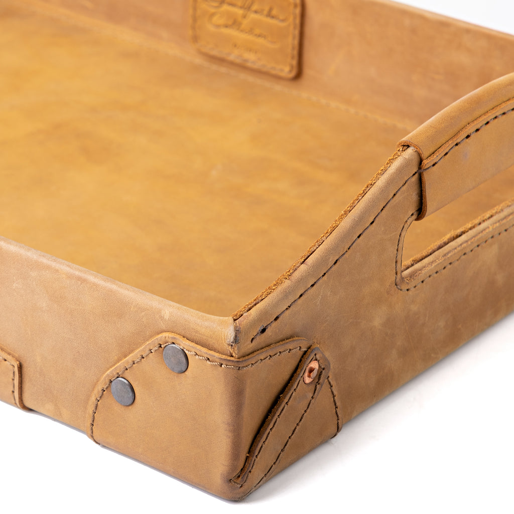 Grandfather Serving Tray in Tobacco leather, close-up of riveted corner, stitching and handle