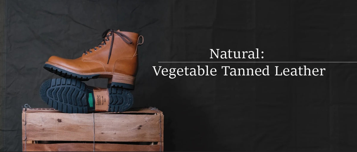 Huntsman Boots - Natural on a wooden crate with outsole shown, banner text Natural: Vegetable Tanned Leather