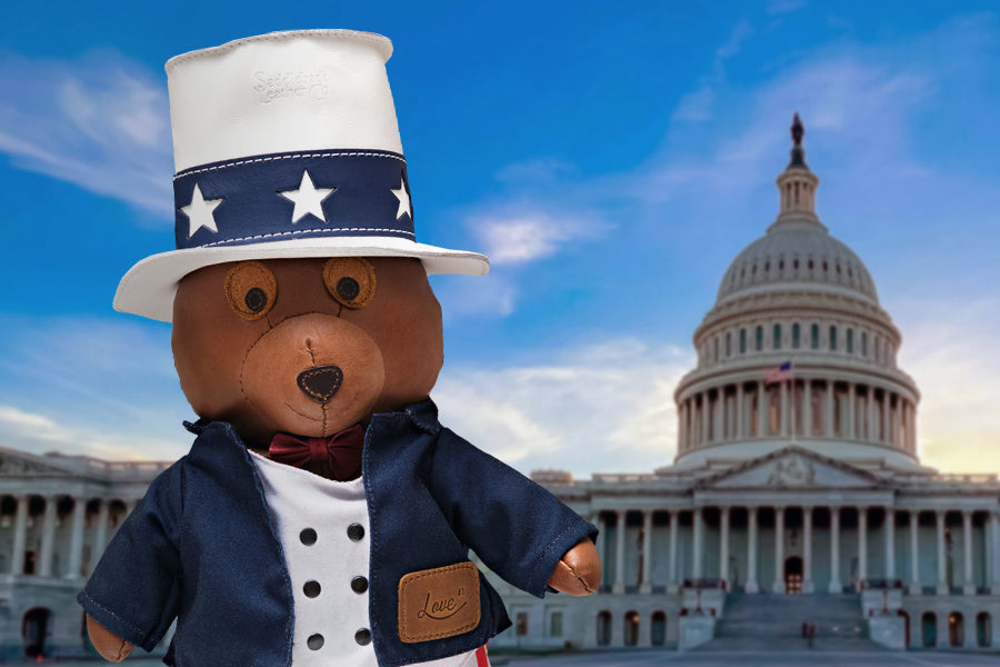 2026 Uncle Sam Teddy Bear close-up in star top hat and navy jacket with the U.S. Capitol dome behind