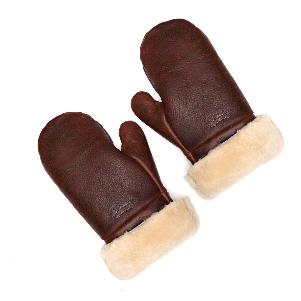 Sheepskin Mittens in reddish brown leather with cream shearling cuffs, pair laid flat, top view