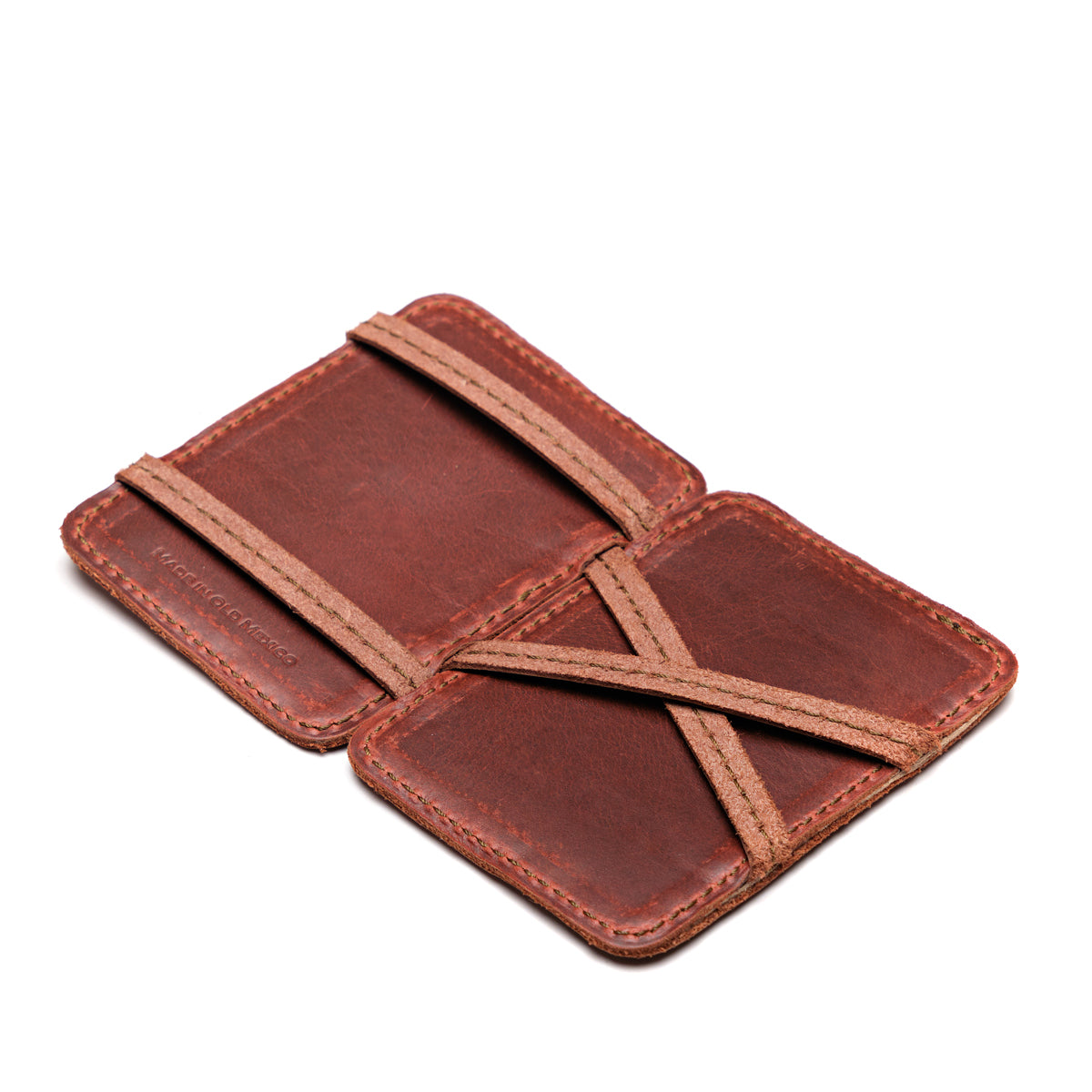 Front Pocket Magic Wallet in Chestnut opened flat to show the crossed leather straps inside