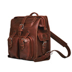Big Mouth Leather Backpack in Chestnut, angled front view with buckled pockets and shoulder strap