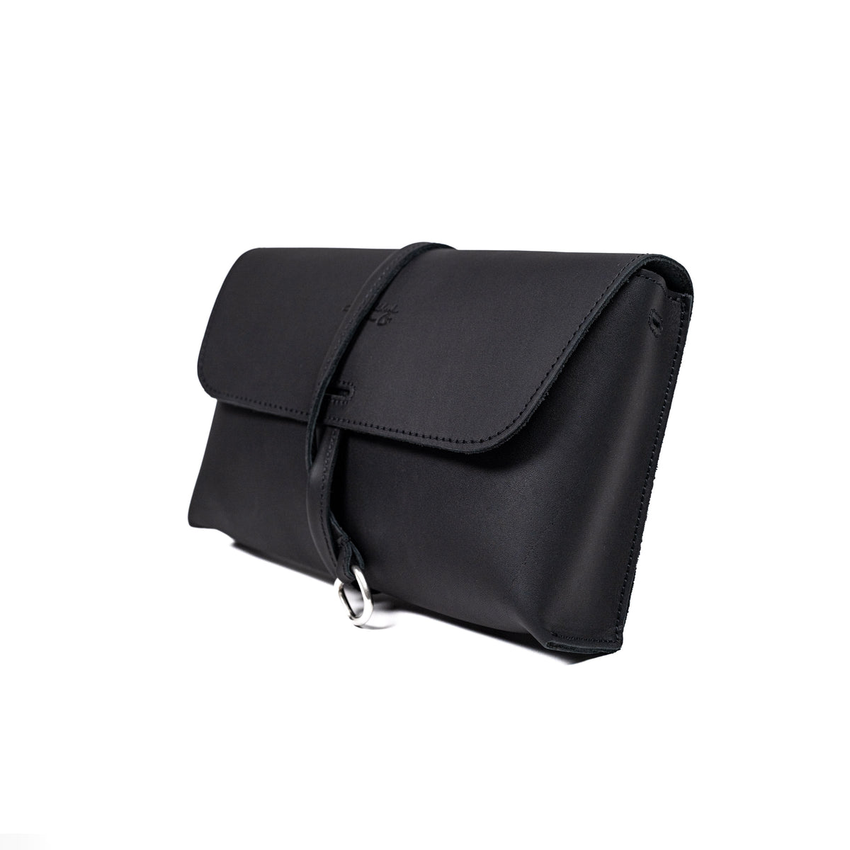 Large Leather Organizer Bag in Black, closed flap with wrapped leather tie and ring, angled view