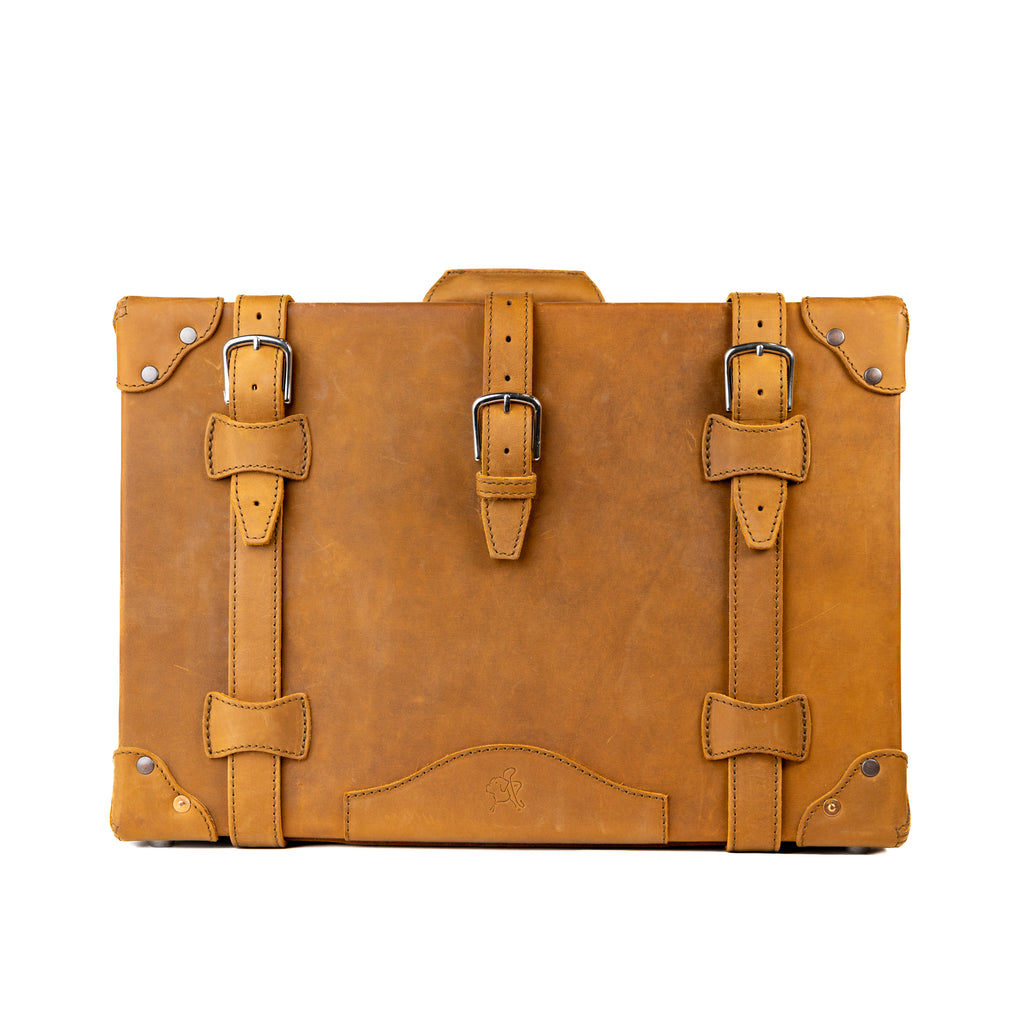 Grandfather Carry On in Tobacco, front view with three buckle straps and riveted corner caps