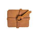 Leather Coaster Set in Tobacco, stacked coasters wrapped and knotted with a leather tie