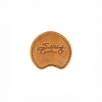 Auto Organizer Set leather cupholder coaster in Tobacco, top view with embossed Saddleback logo
