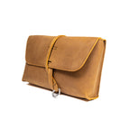Large Leather Organizer Bag in Tobacco, closed flap with wrapped leather tie and ring, angled view