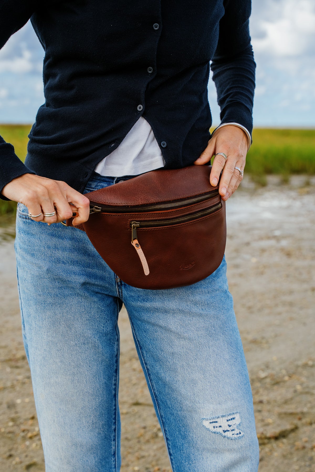 High quality model shot of the dark coffee fanny leather bag