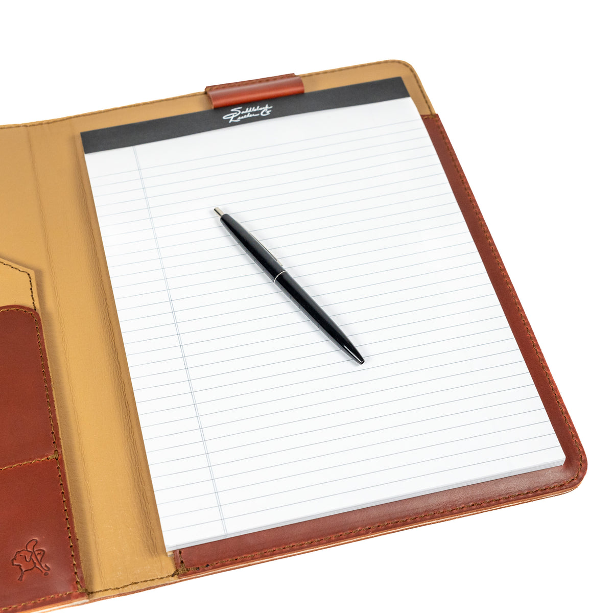 Old Design Medium Leather Portfolio in Chestnut, open with a legal pad and pen, angled close-up