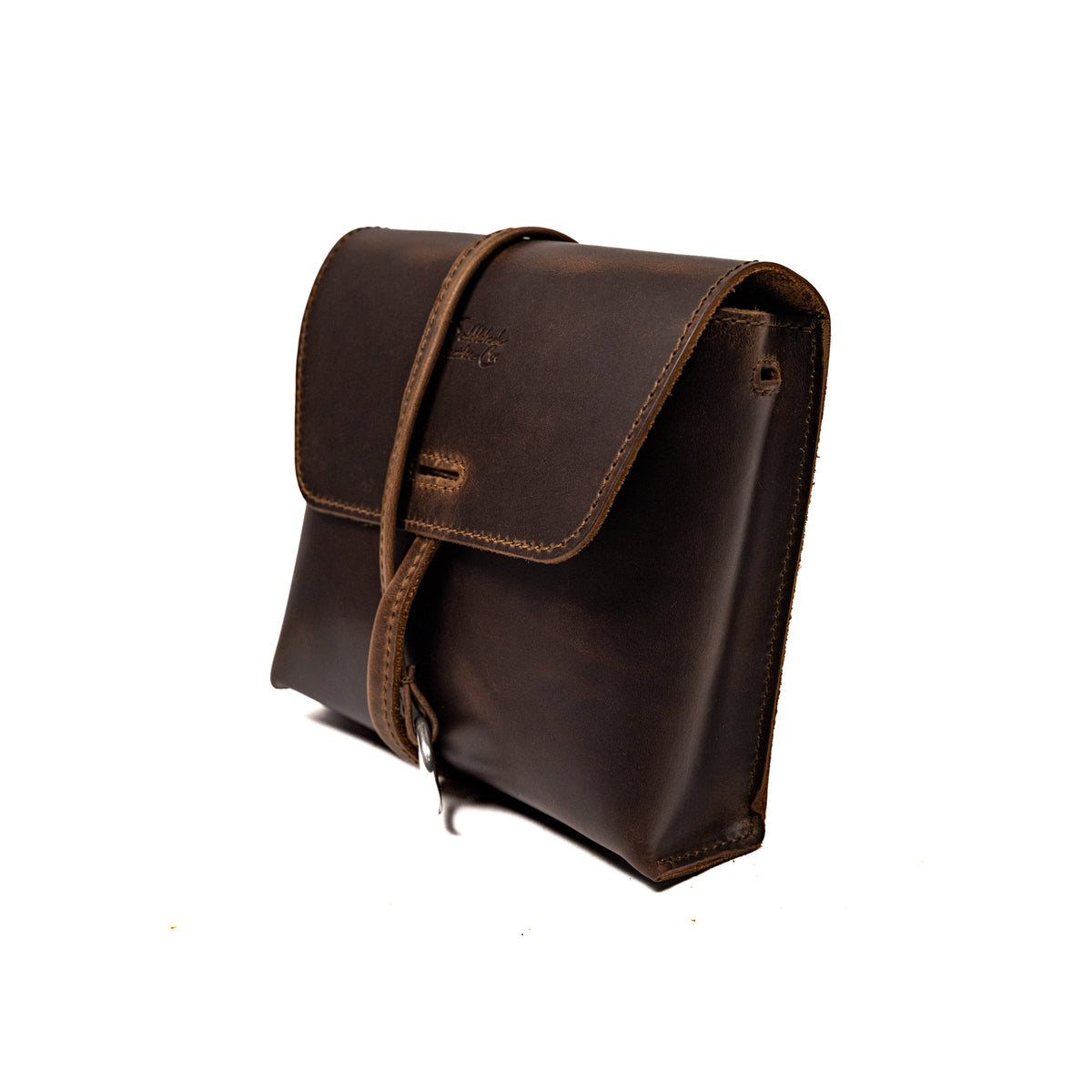 Leather Organizer Bag in Dark Coffee Brown, three-quarter view with flap closure and strap wrapped around the front