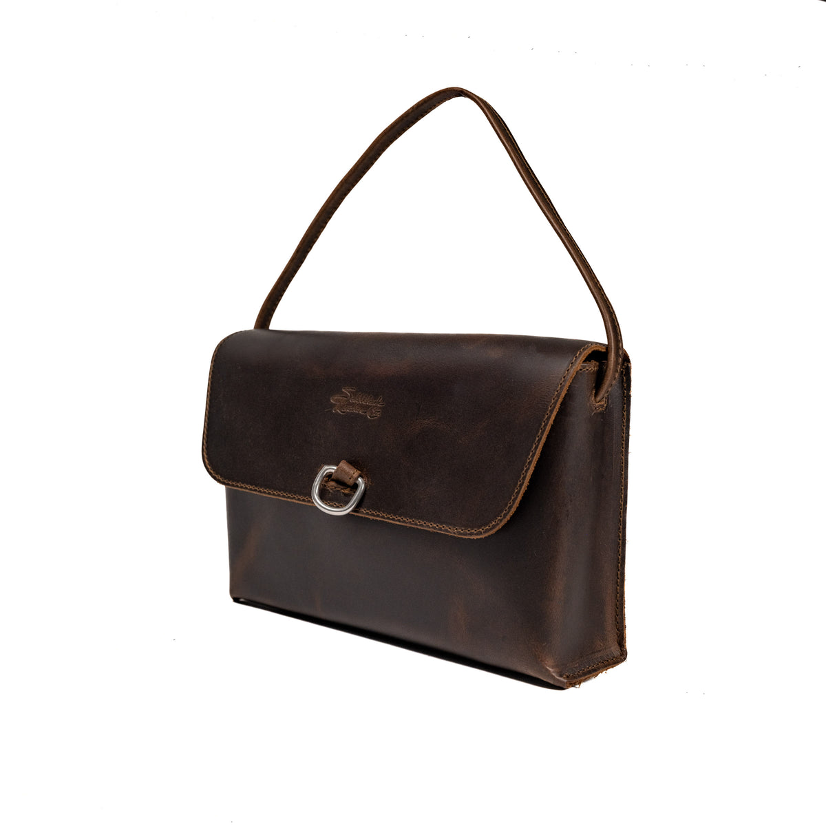 Large Leather Organizer Bag in Dark Coffee Brown, angled view with tie looped up as a carry handle and metal ring on the flap