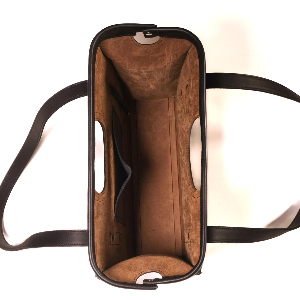 Professional Leather Tote in Black, top view open and empty showing suede lining and interior slip pocket
