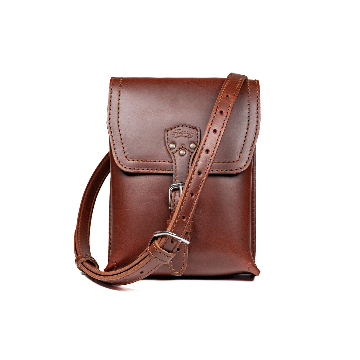 Leather Travel Satchel in Chestnut, front view with adjustable shoulder strap draped across the bag