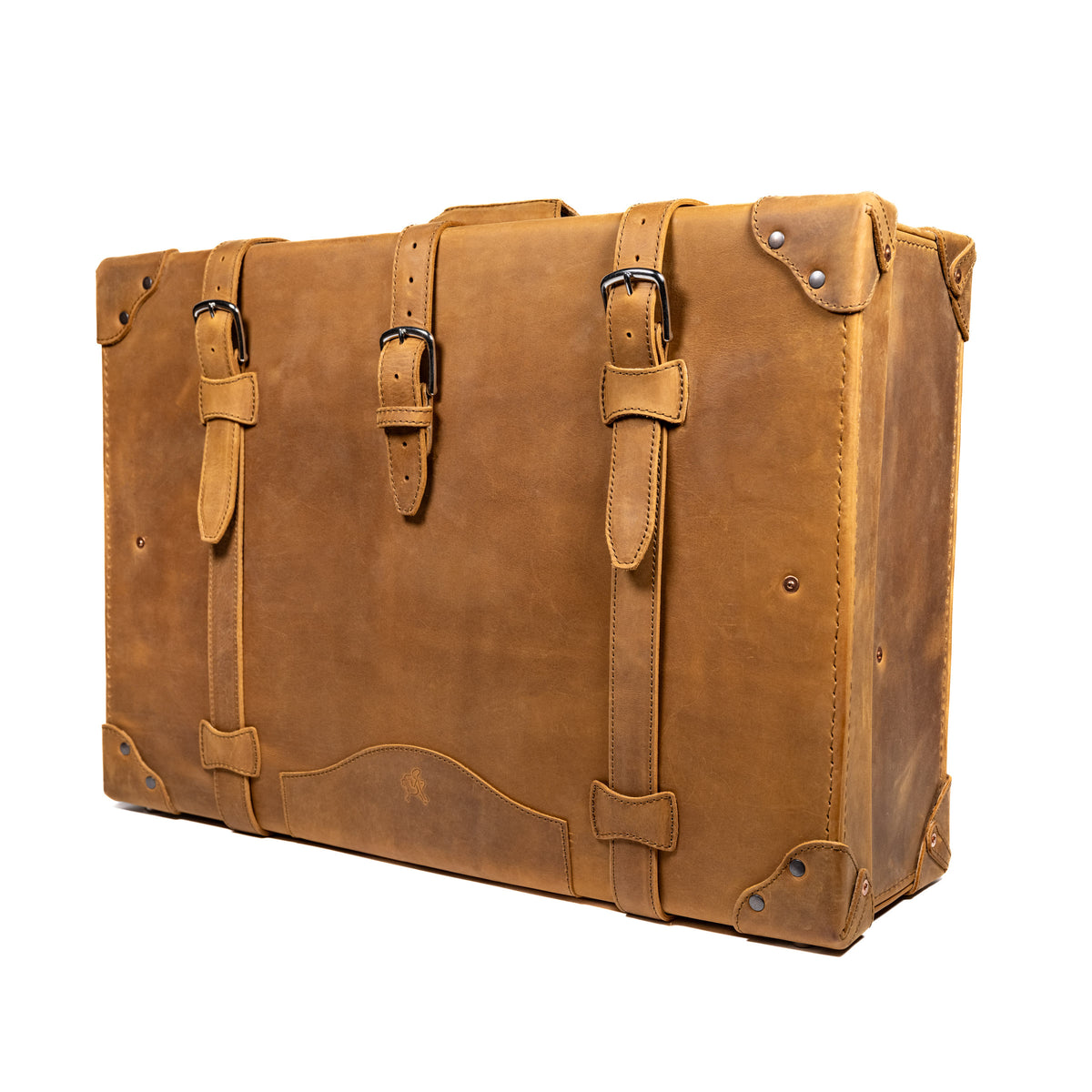 Grandfather Suitcase in Tobacco, angled front view with buckle straps and riveted corner caps