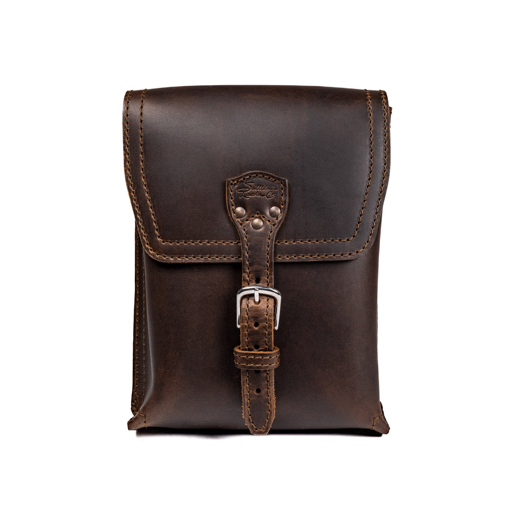 Leather Travel Satchel in Dark Coffee Brown, front view with buckled strap closure on the flap