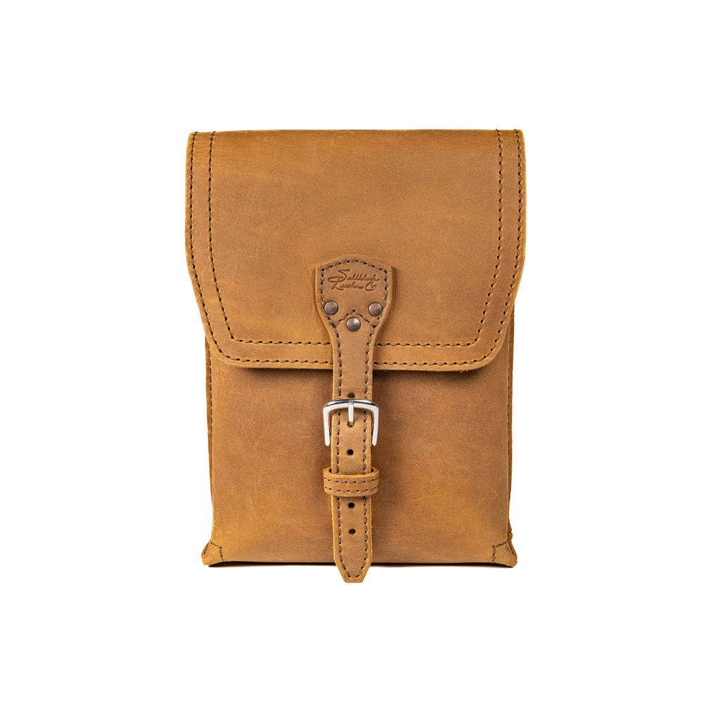 Leather Travel Satchel in Tobacco, front view with buckled strap closure on the flap