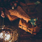 20" Waterbag in Tan used as a footrest by a campfire while roasting marshmallows