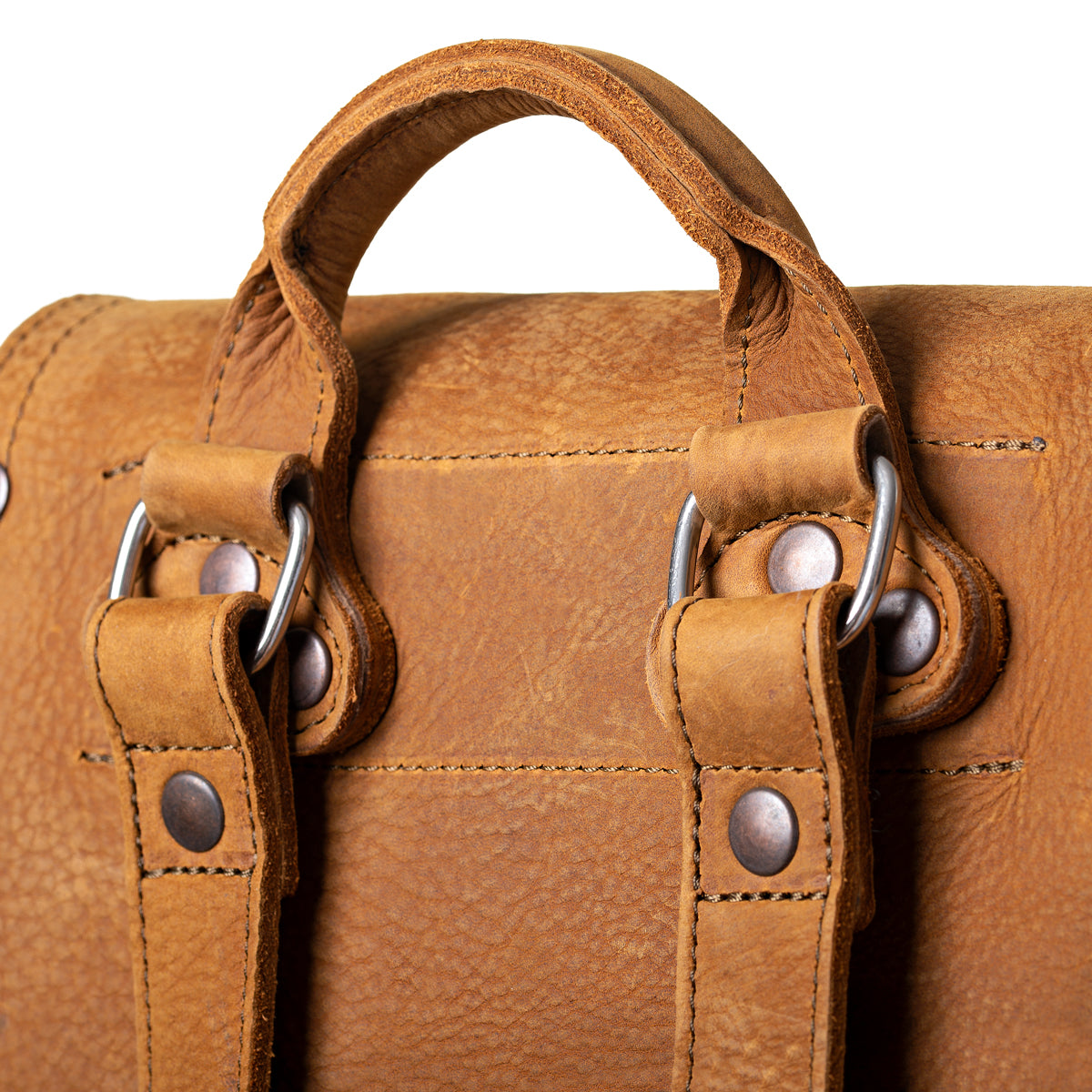 12" Drawstring Backpack in Tobacco, close-up of top handle, strap rings and rivets on the back