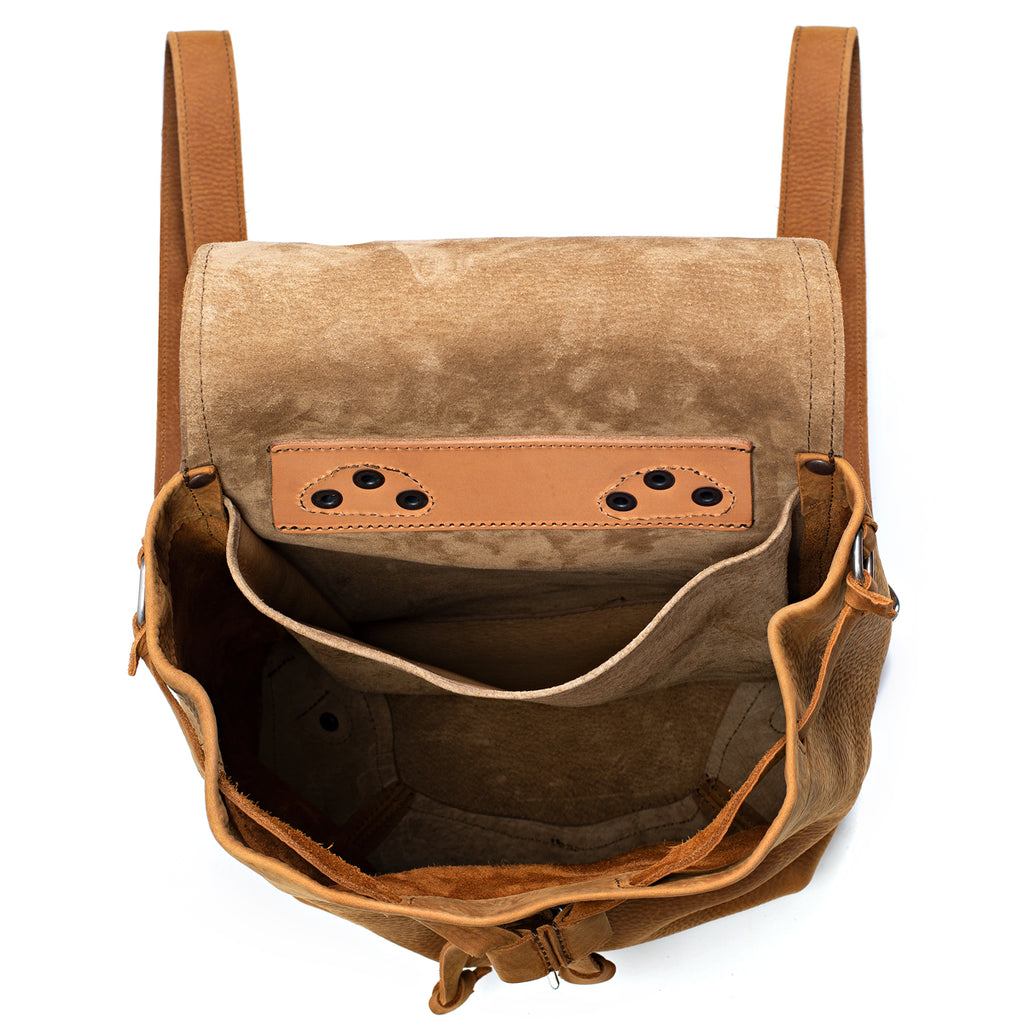 12" Drawstring Backpack in Tobacco, top view open and empty showing interior pockets and suede lining