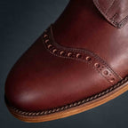 Officer's Boot in Oxblood, angled close-up of the toe cap perforations and welt