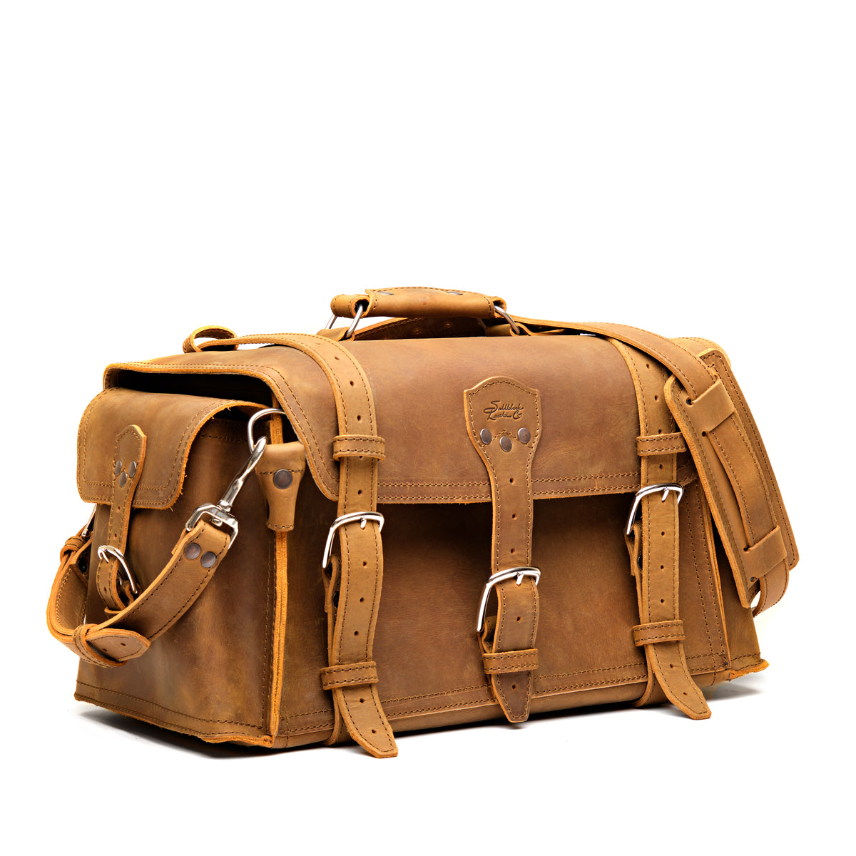 Side Pocket Leather Duffle in Tobacco, angled front view with buckle straps, side pocket and shoulder strap