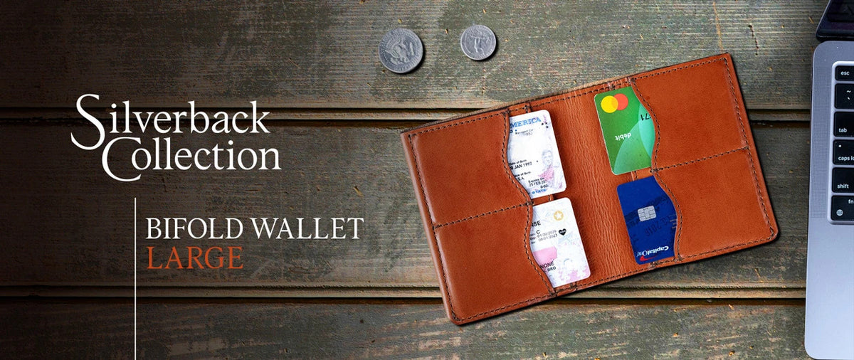 Large Bifold Wallet-Silverback in English Tan open with cards by a laptop, banner text Silverback Collection Bifold Wallet Large