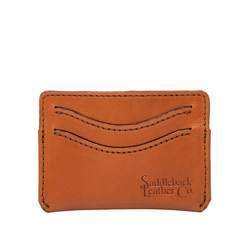 Flat tan leather card wallet with two curved card slots and dark edge stitching.