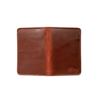 Slim Passport Wallet in Chestnut opened flat face down, showing the full outer cover and embossed logo