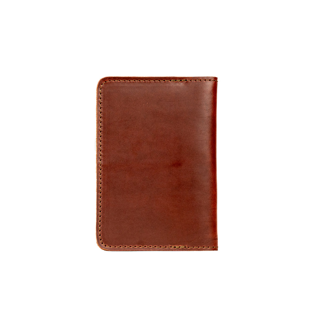 Slim Passport Wallet in Chestnut, closed back view with stitched edges and rounded corners