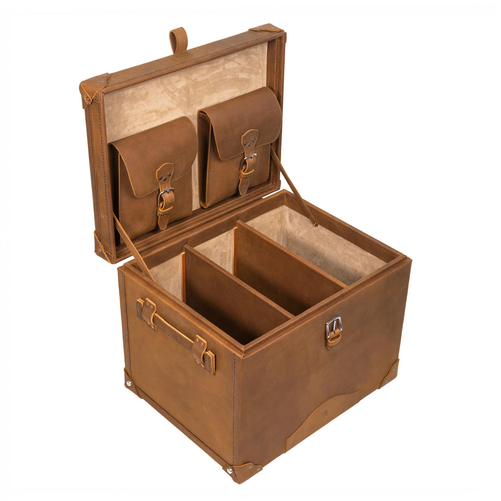 Leather Small Trunk in Tobacco, open with two buckled lid pockets and leather dividers inside a suede-lined interior
