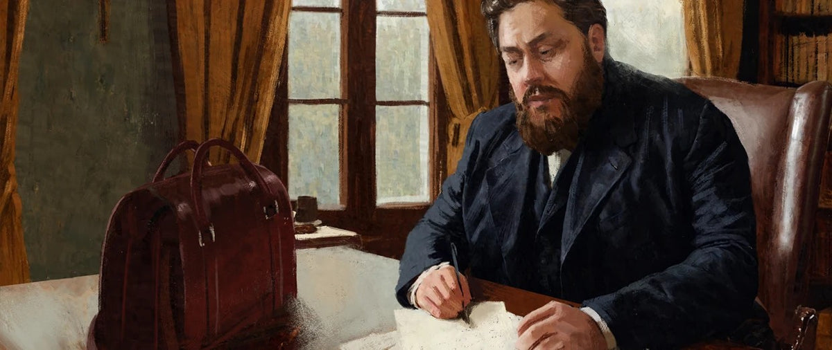 Spurgeon Briefcase in Oxblood on a desk in a painted-style study scene of a bearded man writing by a window