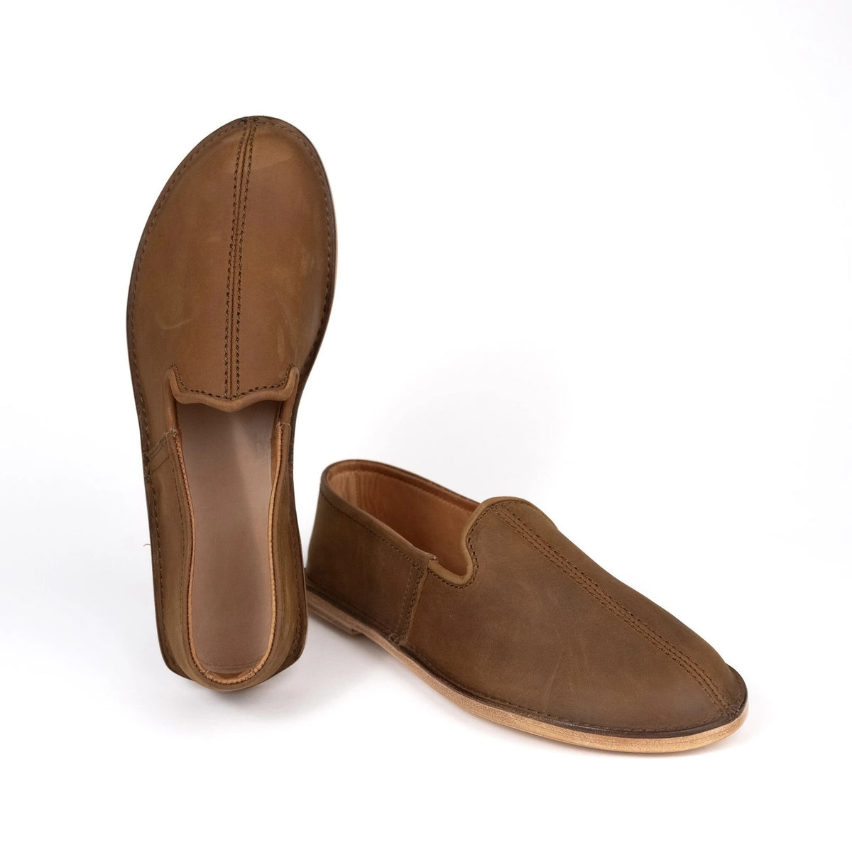 Tan leather barefoot minimalist slip-on shoes, top and side view on a white background