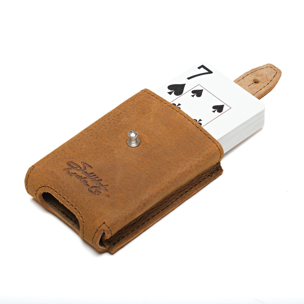 Leather Playing Cards Case in tan, opened with a deck of cards sliding out