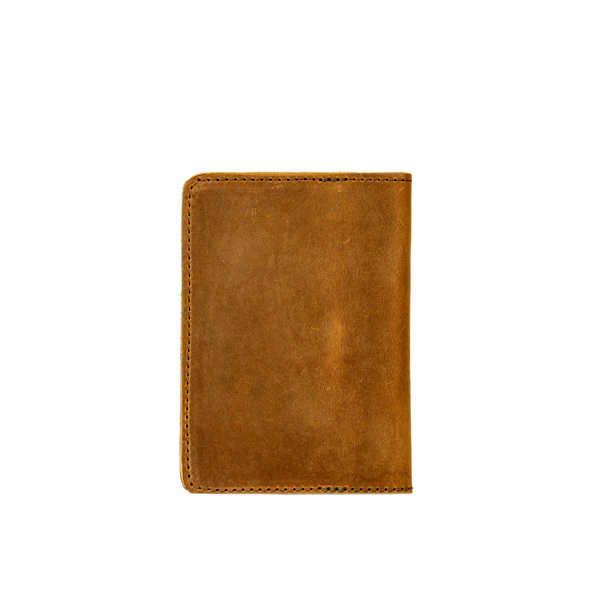 Slim Passport Wallet in Tobacco, closed back view with stitched edges and rounded corners