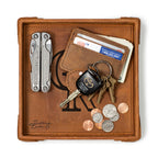 Colorado Rockies Leather Valet Tray in Tobacco, top-down view holding a multi-tool, card wallet, keys and coins