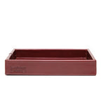 The Simple Leather Valet Tray in Oxblood, straight-on side view showing embossed Saddleback Leather Co. logo