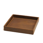 The Simple Leather Valet Tray in Tobacco, empty, angled view showing stitched corner seams and embossed logo